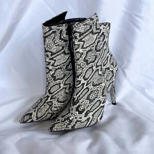 Express black and white snakeskin booties